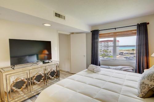 a bedroom with a large bed and a flat screen tv at El Matador 152 - FREE TICKETS!! Your stay includes free tickets to many area attractions! in Fort Walton Beach