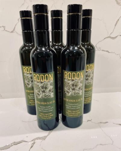 three bottles of red wine sitting on a counter at Duplex Seaview Condo in Durrës
