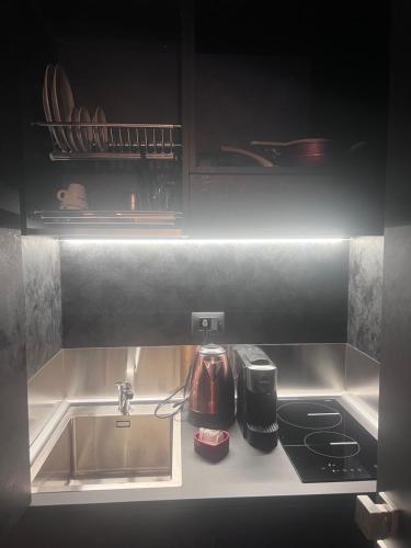 Η κουζίνα ή μικρή κουζίνα στο Anemone Bianco Suite Rooms
