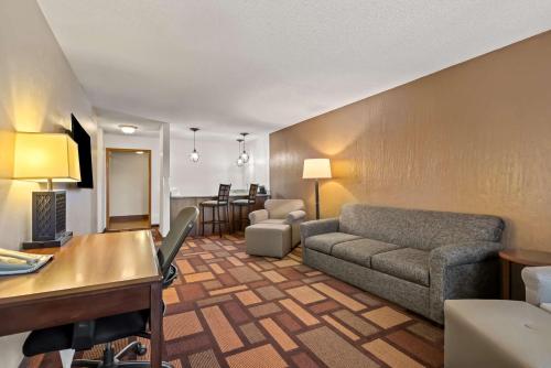 a living room with a couch and a table at Best Western Tower West Lodge in Gillette