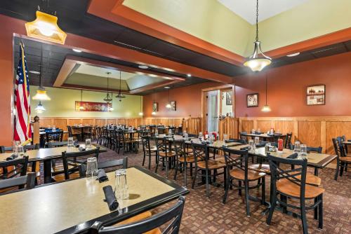 a dining room with tables and chairs at Best Western Tower West Lodge in Gillette