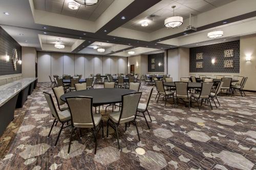 a conference room with tables and chairs in it at Drury Plaza Hotel Dallas Richardson in Richardson