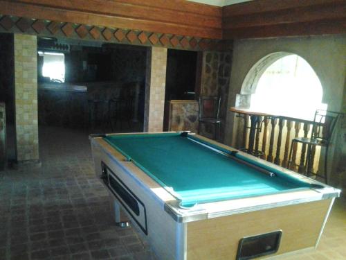 a pool table in the middle of a room at Proland Inn in Lokichokio