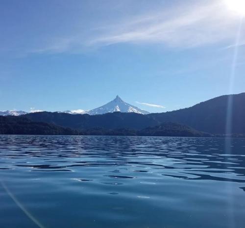 a large body of water with mountains in the background at Hostal La Casona Ensenada con parking in Ensenada