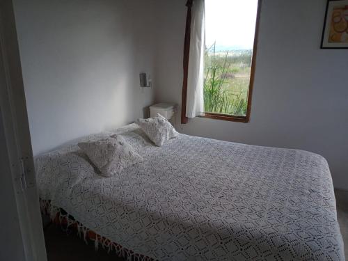 Ένα ή περισσότερα κρεβάτια σε δωμάτιο στο Alquiler en Villa Yacanto