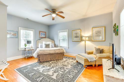 a bedroom with a bed and a ceiling fan at 1 Mi to Dtwn Wilmington Quiet Cottage with Deck in Wilmington