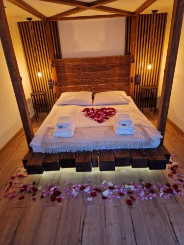 a bedroom with a bed with flowers on the floor at GÓRALÓWKA - Radawa in Radawa