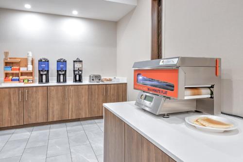 a coffee machine on a counter in a room at Holiday Inn Express Hotel & Suites Dallas West by IHG in Dallas