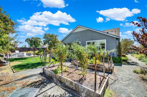 a home with trees in a garden at 1 Mi to Dtwn Winters Home with Fire Pit and Patio! in Winters