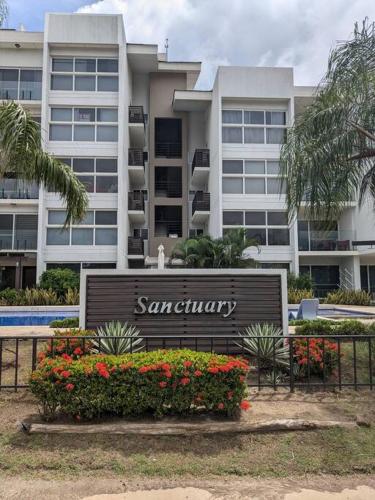 a sign in front of a large building at White Sands, Aquamarine waters and High Surfs in Punta Chame