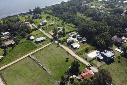 an aerial view of a neighborhood with houses and trees at Morada da Lagoa in Garopaba
