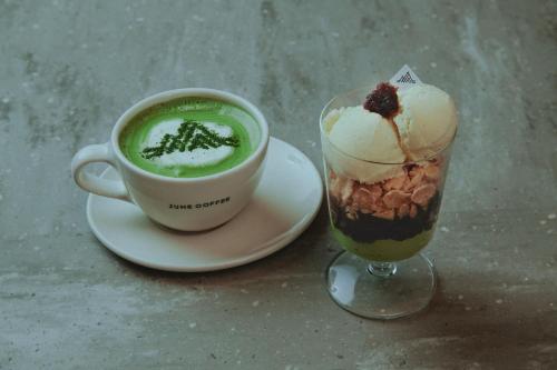 a cup of coffee and a cup of green drink at fav ISE in Ise