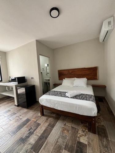 Postel nebo postele na pokoji v ubytování Suites 15 Avenida
