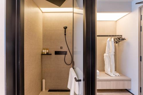 a bathroom with a shower and a toilet at Crystal Hotel Shanghai North Sichuan Road on the Bund in Shanghai