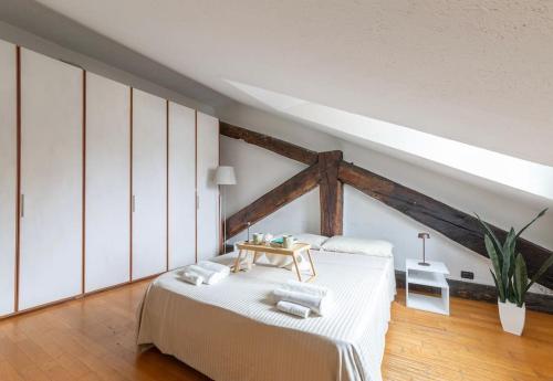 Ένα ή περισσότερα κρεβάτια σε δωμάτιο στο Golden View Milan