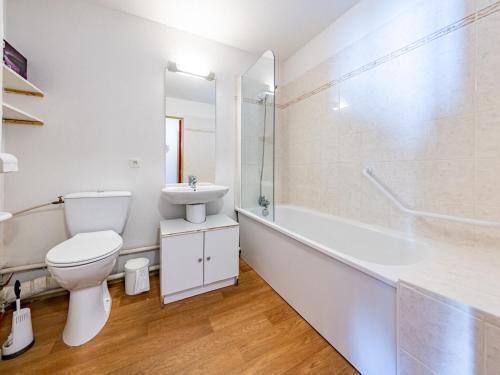 a white bathroom with a toilet and a sink at Appartement lumineux 6 pers aux pieds des pistes, Saint-François-Longchamp - FR-1-807-30 in Saint-François-Longchamp