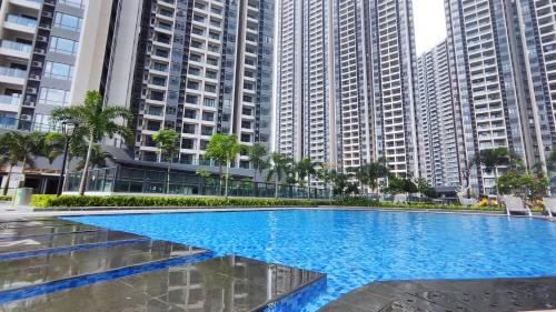 a large swimming pool with tall buildings in the background at R&F Princess Cove View Residences by WSD in Johor Bahru