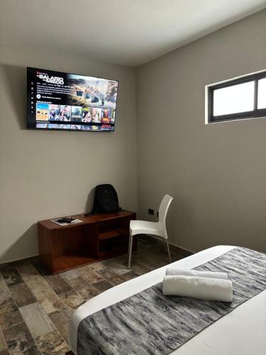 TV a/nebo společenská místnost v ubytování Suites 15 Avenida
