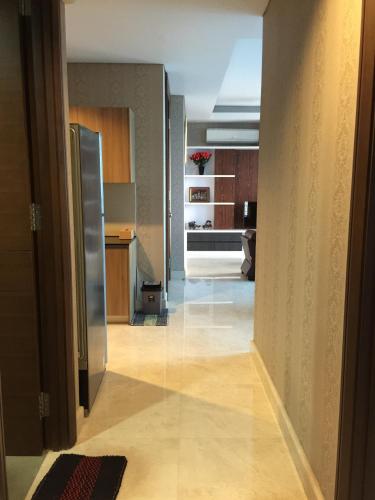 a view of a hallway with a kitchen and a hallway at Signature Apartment @ The Windsor in Jakarta