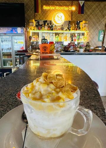 a cup of food sitting on a table at Seaview Moonrise Café in Alcoy