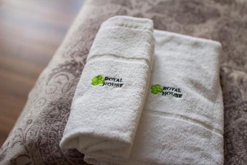 a close up of a towel with two stickers on it at Royal House in Gdańsk