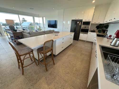 a kitchen with a table and chairs and a couch at Middy's in Middleton