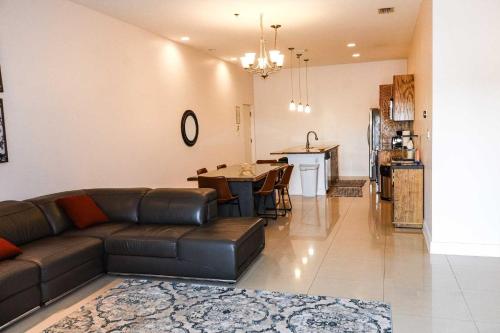 a living room with a couch and a dining room at La Isla C206 condo in South Padre Island
