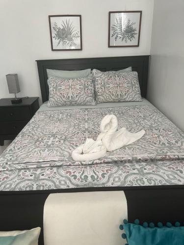 a bedroom with a bed with a towel on it at Chalet Belizomi Tropical Villas Studio Villa #3 in Gros Islet