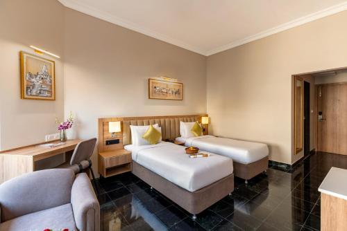 Katil atau katil-katil dalam bilik di Hotel Vishnupriya