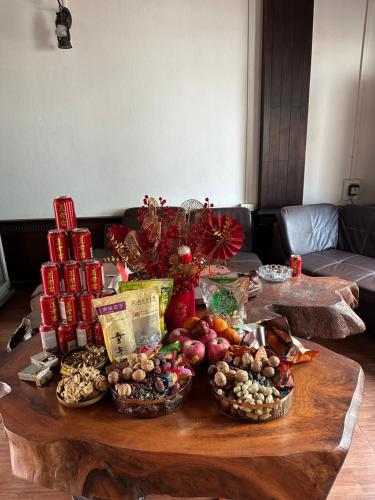 a table with many baskets of food on it at Chandala Hotel in Thakhek