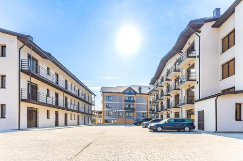 an empty parking lot in an apartment complex at Garda - Breakfast included in the price Restaurant Free Parking Mountain view Kitchen in the apartment separate entrance in Bukovel