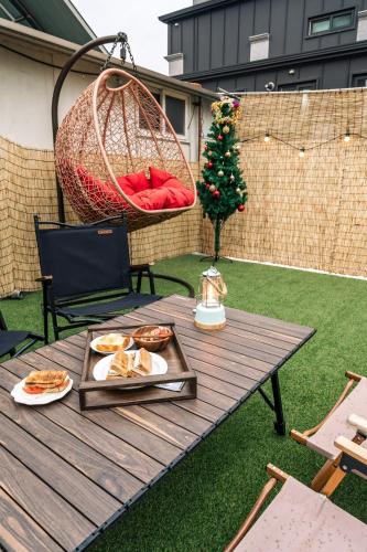 a picnic table with food and a christmas tree at Terastay in Seoul