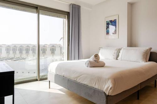 Un ou plusieurs lits dans un hébergement de l'établissement TheCasaEdition - Bel Azur - Sea View & Hassan II Mosqué Residency