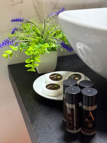 a bathroom counter with a toilet and a sink at La Maison Rose in Maiori