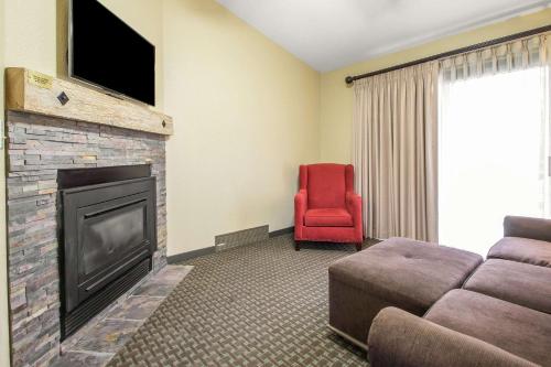a living room with a couch and a fireplace at Bluegreen Vacations Christmas Mountain Village, an Ascend Collection Resort in Wisconsin Dells