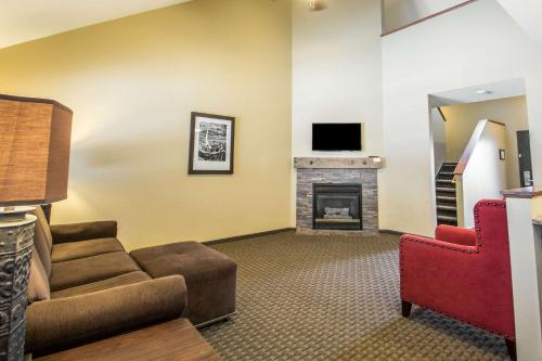 a living room with a couch and a fireplace at Bluegreen Vacations Christmas Mountain Village, an Ascend Collection Resort in Wisconsin Dells