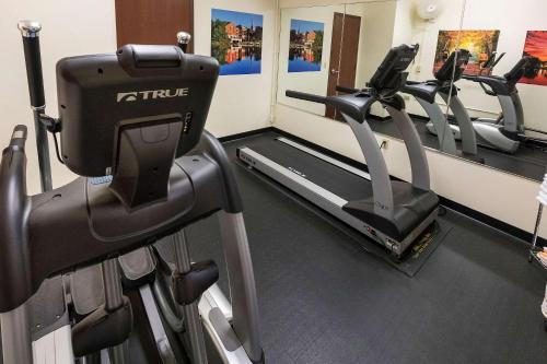 a gym with treadmills and elliptical machines at Kress Inn, an Ascend Collection Hotel in De Pere