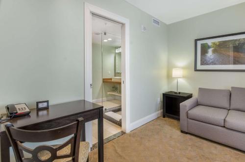 a living room with a desk and a couch at The Gin Hotel, an Ascend Collection Hotel in Lexington