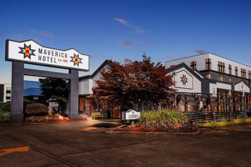 a building with a sign for a hotel at Maverick Hotel Eugene Near University, an Ascend Collection Hotel in Eugene
