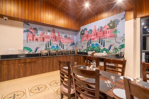 a dining room with a large mural on the wall at Marten's Wilderness Retreat in Lansdowne