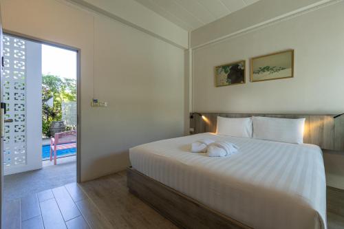 Postel nebo postele na pokoji v ubytování Ang Pao Hotel Phuket