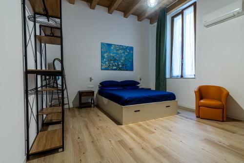 a bedroom with a bunk bed and a ladder at Al Merlo da Diego in Cagliari