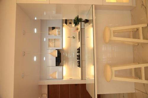 a glass display case in a room at The Crystal Apartment in Trivandrum