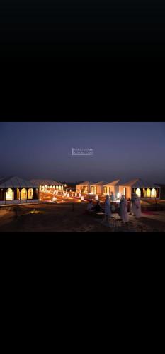 a picture of a parking lot at night at La Sultana Luxury Camp in Merzouga