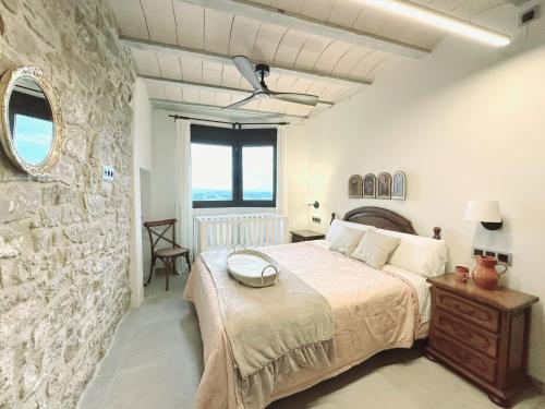 Postel nebo postele na pokoji v ubytování Casa Rural Cal Roseto con jacuzzi