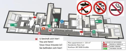 a floor plan of a building with signs on it at Top location! Unique luxurious 3-bedroom apartment in Knokke - 't Zoute in Knokke-Heist