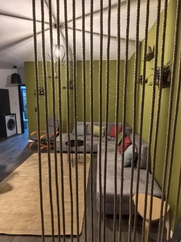 a cage with a bed in a room at Best City Green in Craiova