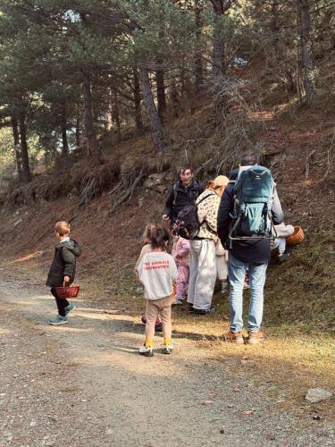 a group of people walking down a dirt road at Basecamps Cerdanya in Queixans