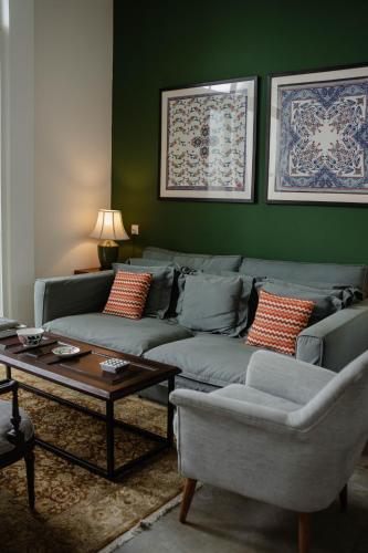 a living room with a couch and a table at Villa Sayura in Boossa