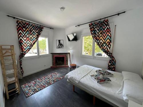 a bedroom with a bed and a fireplace at Casa Vallromanes Rest House in Vallromanas